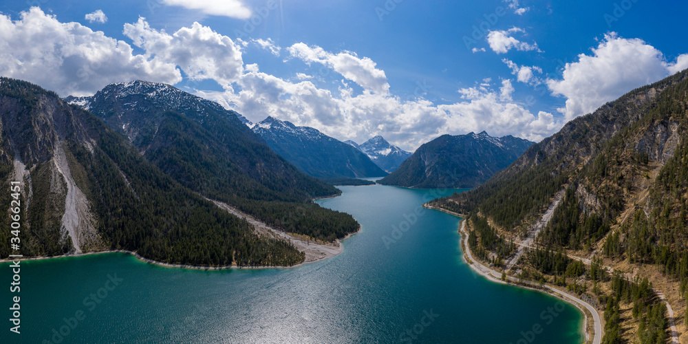 aerial view to blue  lake plansee at spring with austrian mountain slps