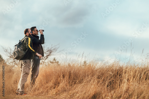 tourist couple, travellers hiking in nature