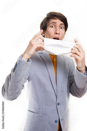 Coronavirus virus in 2020 flu, epidemic. a man wears a protective mask on a white background photo