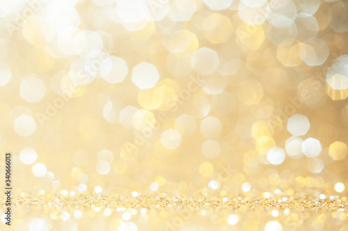 Gold, yellow abstract light background, Pink Gold bokeh shining lights, sparkling glittering Christmas lights.Season greeting background.New year Luxury backdrop image.Blurred abstract background.