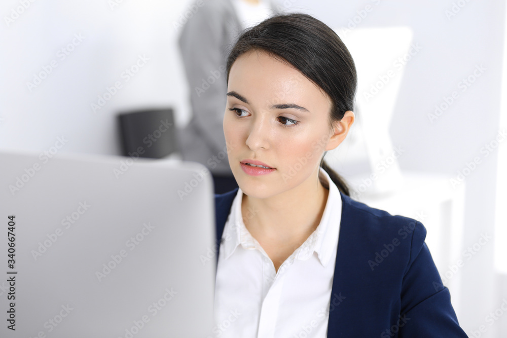 Businesswoman working with computer in office. Lawyer or accountant sitting at work, headshot. Business concept Businesswoman working with computer in office. Lawyer or accountant sitting at work, headshot. Business concept