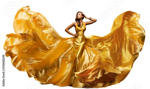 Woman in Fluttering Gold Dress on White, Waving Silk Cloth, Artistic Fashion Model in Golden Color Fabric