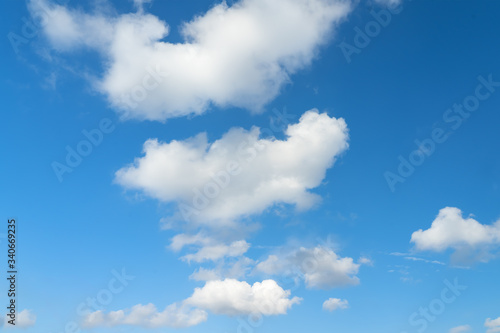 Large white clouds on a blue sky. Clear day. Background, blank for designers.