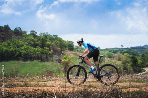 Mountain biker cyclists training Mountain trail