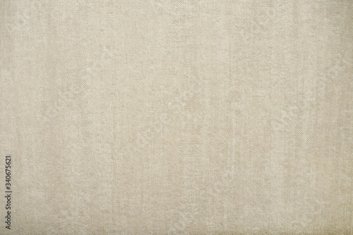 Closeup of beautiful fabric in light grey and beige tone with texture and rough surface for background and decoration. Cool banner on page and cover