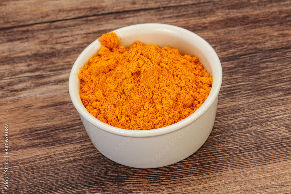 Tumeric powder in the bowl Tumeric powder in the bowl