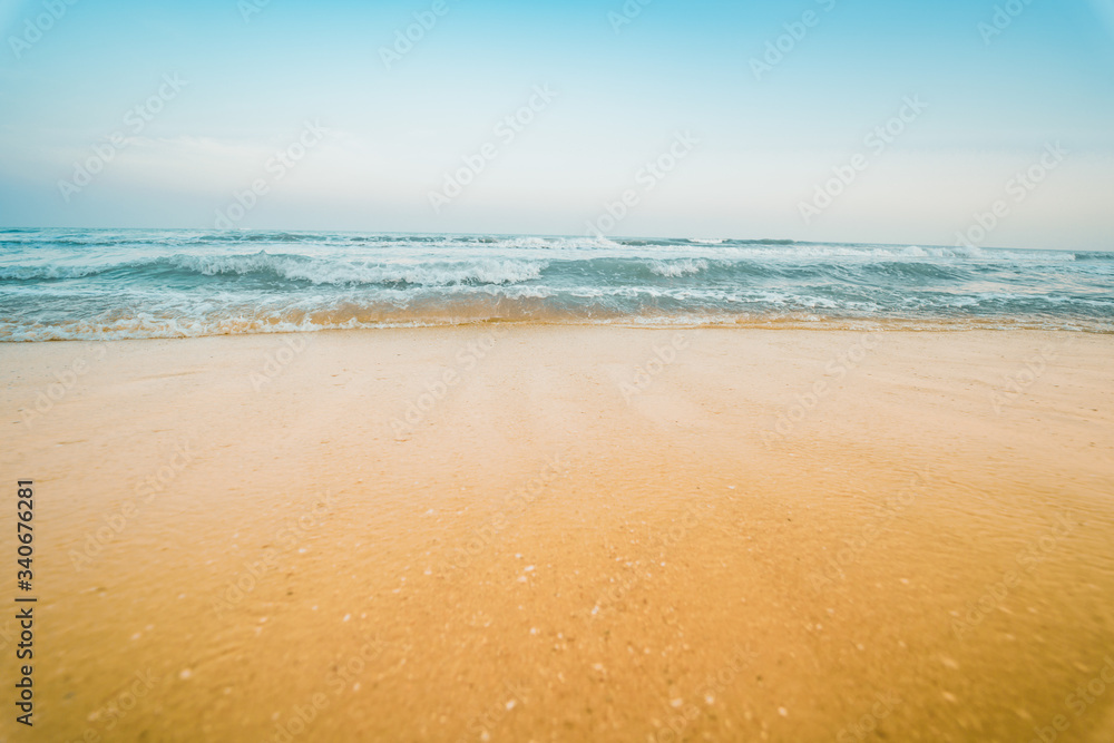 summer season travel from sand beach with wave and blue sky background