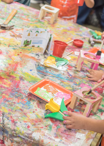 Wallpaper Mural Kid hands painting craft at building workshop in local hardware store in Texas, USA Torontodigital.ca