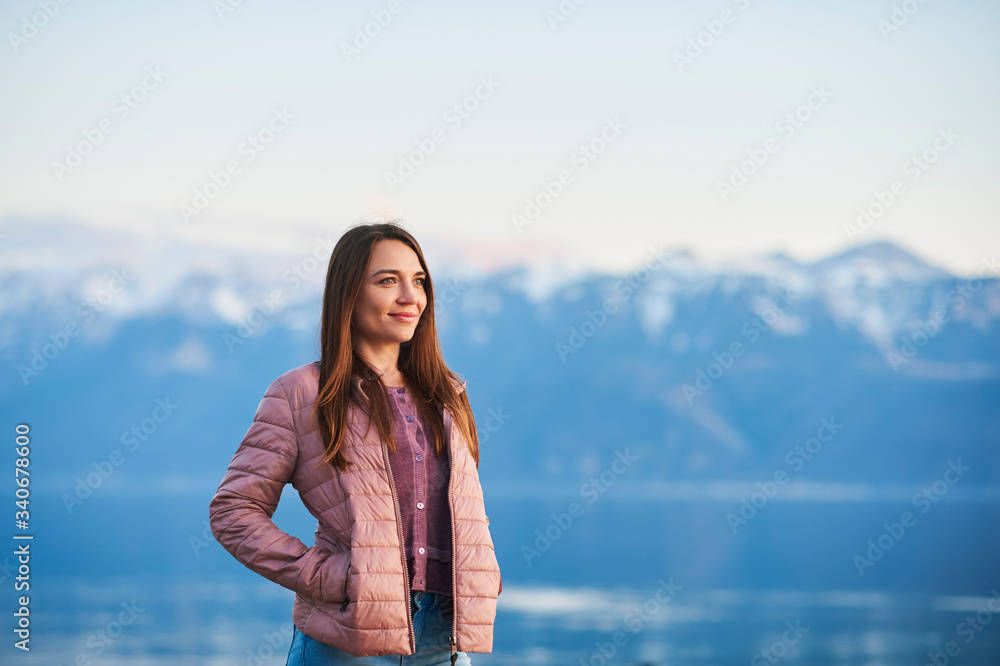 Outdoor portrait of beautiful young woman relaxing by the lake Outdoor portrait of beautiful young woman relaxing by the lake