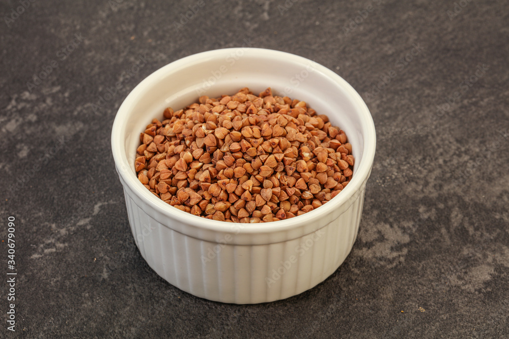 Raw buсkwheat cereal in the bowl Raw buсkwheat cereal in the bowl