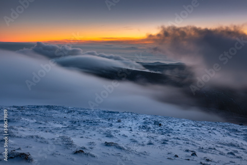 First snow in November in Karkonosze Mountains- sunrise in Sniezka peak the highest mountain in Sudety range.
