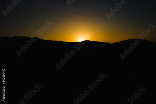 Wallpaper Mural mountain silhoette of austrian alps at sunrise glowing sky Torontodigital.ca