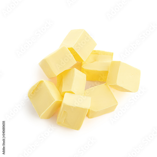 Butter pieces isolated on white background, top view. Fresh butter chunks  close up