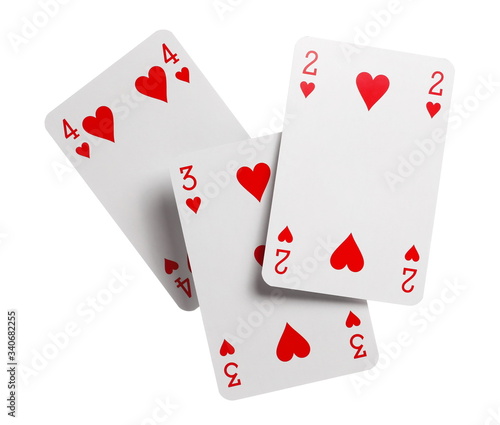 Playing cards for poker, gambling and casinos, red hearts isolated on white background with clipping path