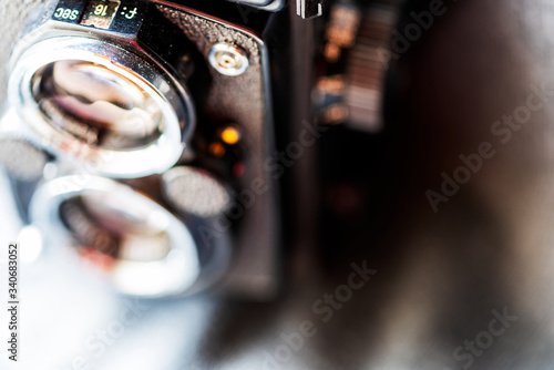 Blurred photo close-up of a fragment of an old Twin Lens Reflex camera. Copyspace