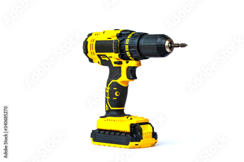 The yellow cordless battery powered drill isolated on white background.