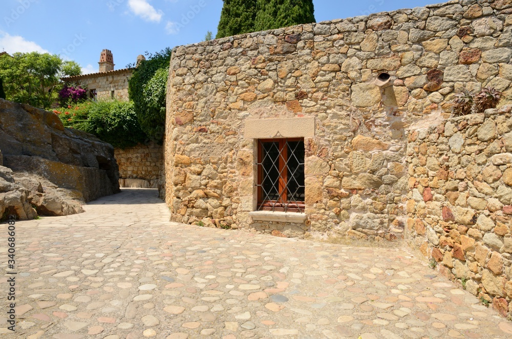 Cobbled footpath in medieval Catalonia village, Spain