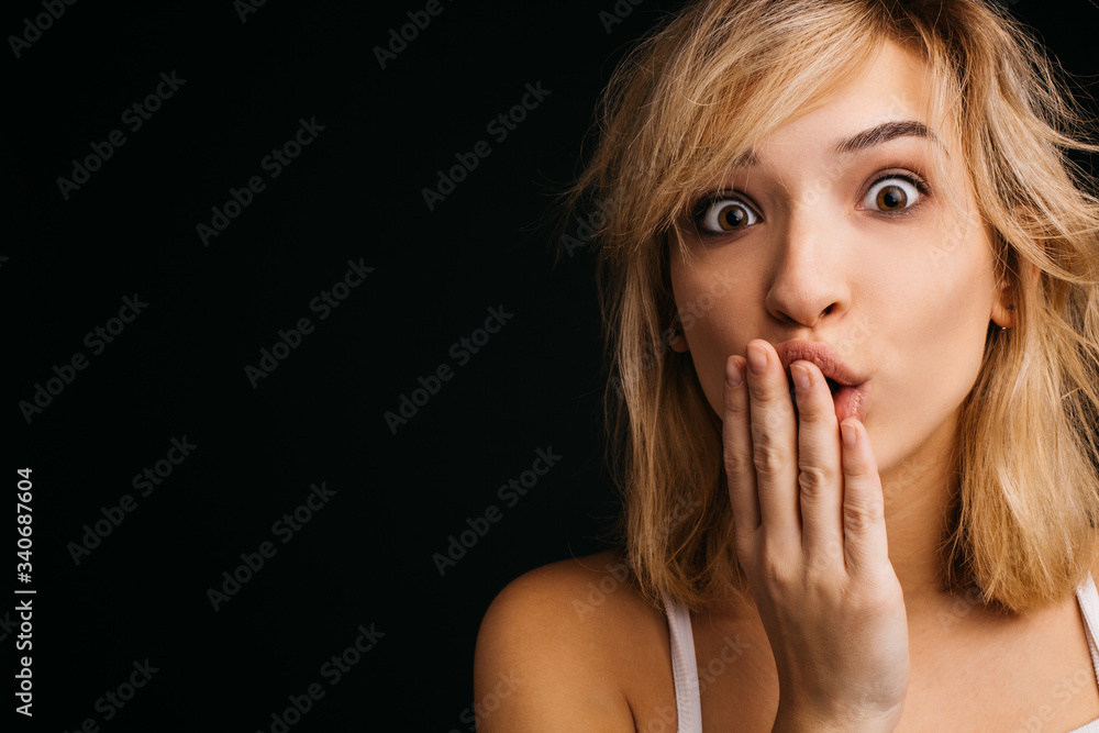 Sexy lovely young woman posing on camera with wonder. Hold hand over lips. Amazed woman isolated over pink background. Sexy lovely young woman posing on camera with wonder. Hold hand over lips. Amazed woman isolated over pink background.