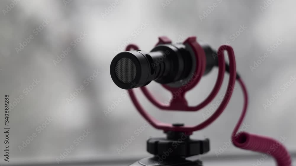 Camera microphone flutters on a vibrating suspension in slow motion. Camera microphone flutters on a vibrating suspension in slow motion.
