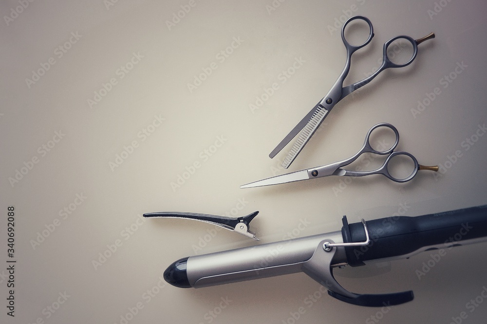 Obraz premium Tools for the work of a hairdresser and stylist in a beauty salon. High quality photo for banner design, website.Place for text.