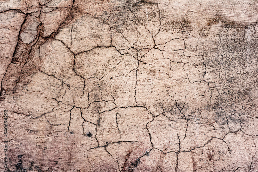 Texture of a concrete wall with cracks and scratches which can be used as a background Texture of a concrete wall with cracks and scratches which can be used as a background