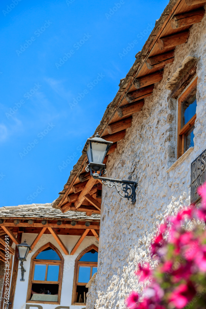 MOSTAR, BOSNIA HERZEGOVINA - 2017 AUGUST 16. Beautiful traditional house in Mostar with flowers outside. MOSTAR, BOSNIA HERZEGOVINA - 2017 AUGUST 16. Beautiful traditional house in Mostar with flowers outside.