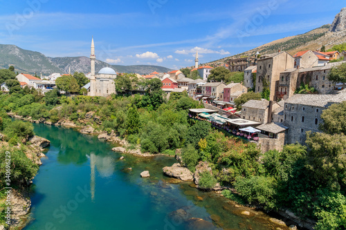 MOSTAR, BOSNIA HERZEGOVINA - 2017 AUGUST 16. Koski Mehmed Pasha Mosque dating to the 17th century, with striking views of the Neretva River.