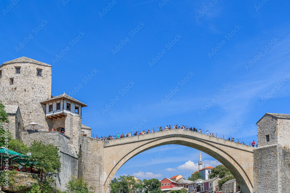 MOSTAR, BOSNIA HERZEGOVINA - 2017 AUGUST 16. The Old Bridge joins east and west Mostar and for many, tells a story of hope and reconciliation after the battle.