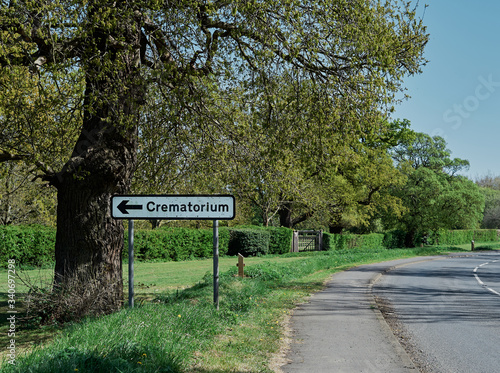Crematorium road sign on the road. Sping time