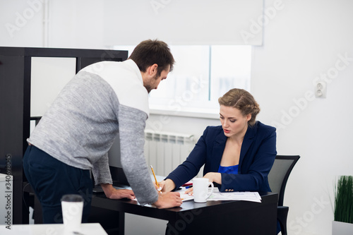 Wallpaper Mural A senior manager giving her comments on the project her employee has just handed in Torontodigital.ca