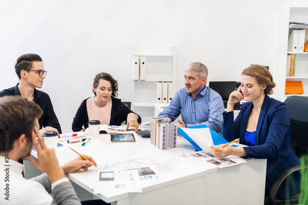 Young team having a meeting with their senior manager in the conference room Young team having a meeting with their senior manager in the conference room