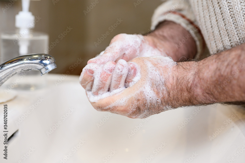 Close up of Senior man washing his hands using soap foam, Prevention from covid19, Coronavirus or Bacteria. Healthcare concept, 7 step hands wash . Close up of Senior man washing his hands using soap foam, Prevention from covid19, Coronavirus or Bacteria. Healthcare concept, 7 step hands wash .