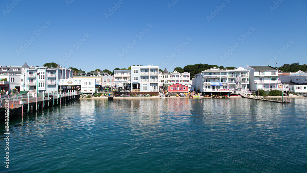 Mackinac Island in Michigan is a premiere vacation destination. The waterfront is a quaint tourist area.