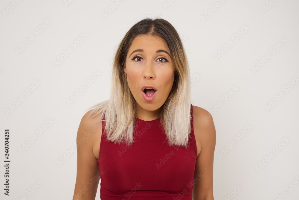 Attractive young woman having stunned and shocked look, with mouth open and jaw dropped, listening to friend's story in full disbelief, exclaiming: Wow, I can't believe this. Surprised girl. Shock Attractive young woman having stunned and shocked look, with mouth open and jaw dropped, listening to friend's story in full disbelief, exclaiming: Wow, I can't believe this. Surprised girl. Shock