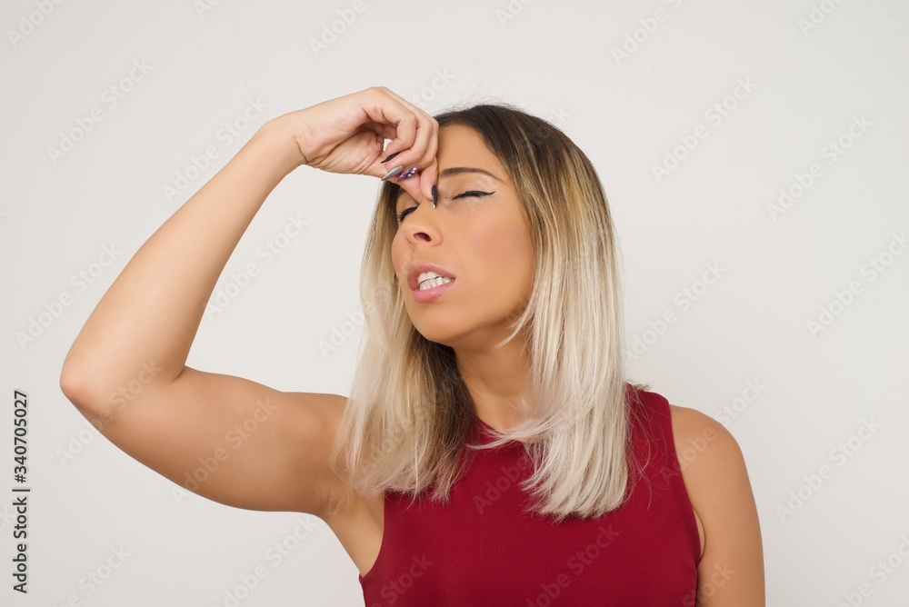 Very upset, charming, nice woman touching nose between closed eyes, want to cry, having stressful relationship, being tired, having troubles with work Very upset, charming, nice woman touching nose between closed eyes, want to cry, having stressful relationship, being tired, having troubles with work