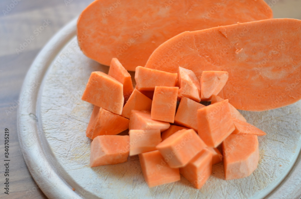 sweet potato cubes on a chopping board sweet potato cubes on a chopping board