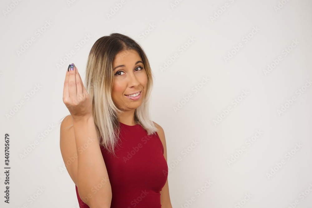 What the hell are you talking about. Shot of frustrated young European woman gesturing with raised hand doing Italian gesture, frowning, being displeased and confused with dumb question. What the hell are you talking about. Shot of frustrated young European woman gesturing with raised hand doing Italian gesture, frowning, being displeased and confused with dumb question.