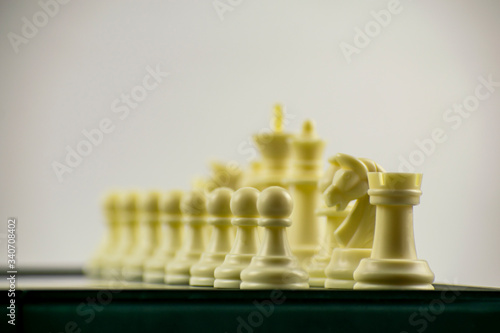 A chessboard with pieces displayed on it.