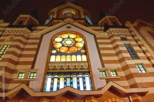 A fragment of the central facade of the New Liberal Synagogue with evening lighting. Kaliningrad