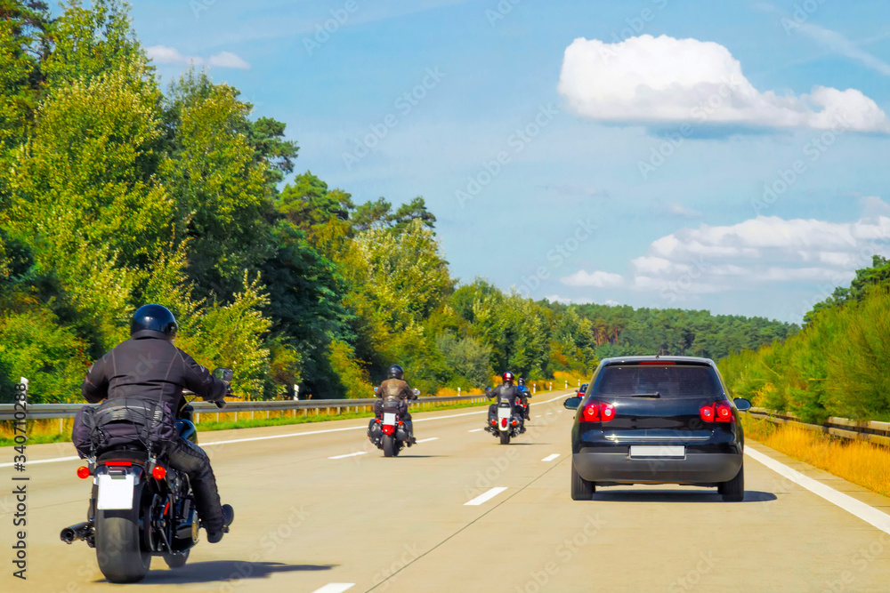 Bikers on Motorbikes on road in Switzerland reflex Bikers on Motorbikes on road in Switzerland reflex