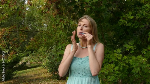 Pretty blond woman Playing Harp. photo