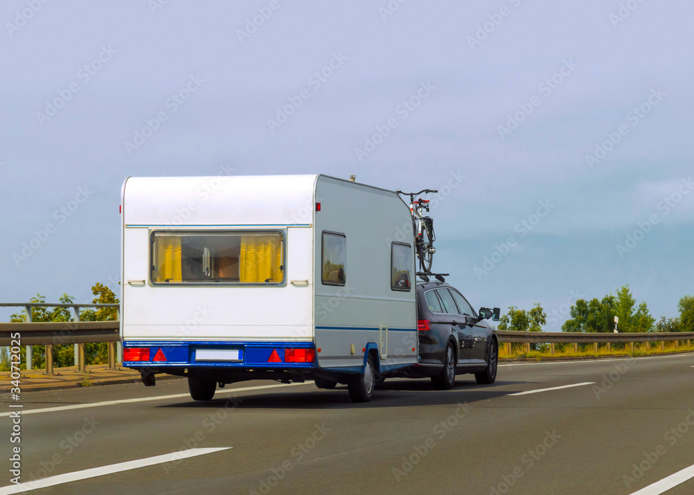 Caravan on road of Switzerland reflex