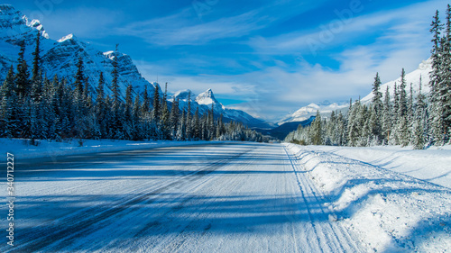 Icy road with snow all along the road, Canada