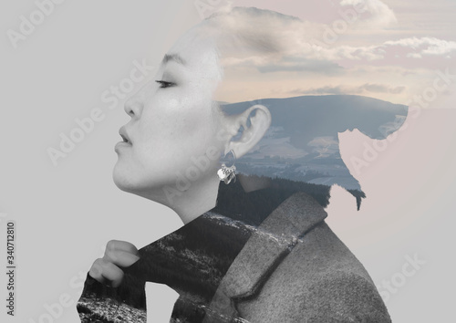 Monochrome double exposure combined photographs with the Asian young woman and mountains.
