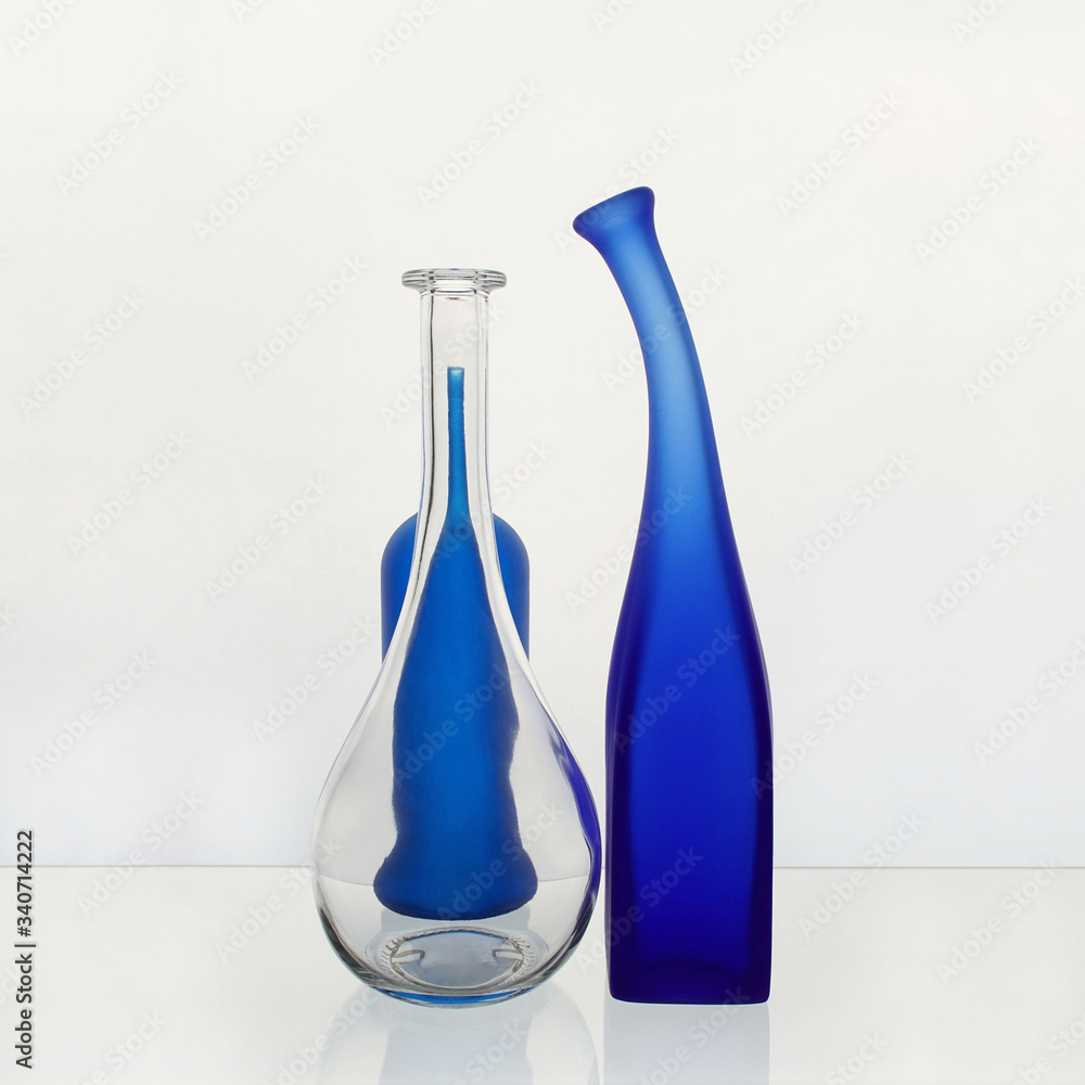 Still life with colored bottles on a white background Still life with colored bottles on a white background