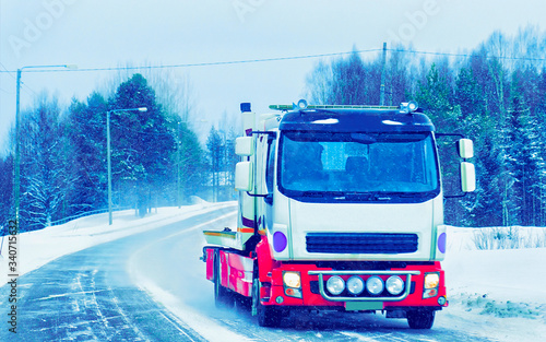 Truck at Snow Road at winter Finland of Lapland reflex