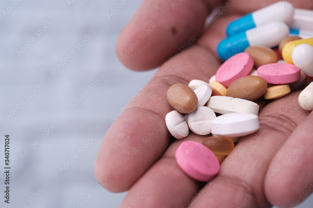 close up of pills and capsule on palm of hand close up of pills and capsule on palm of hand