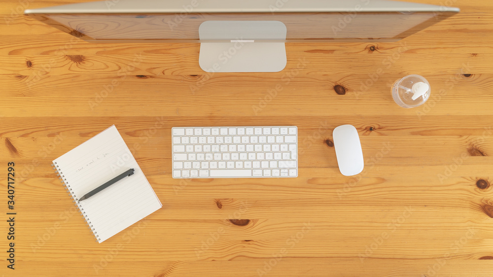 Image from above of minimalist working space with notebook. Image from above of minimalist working space with notebook.