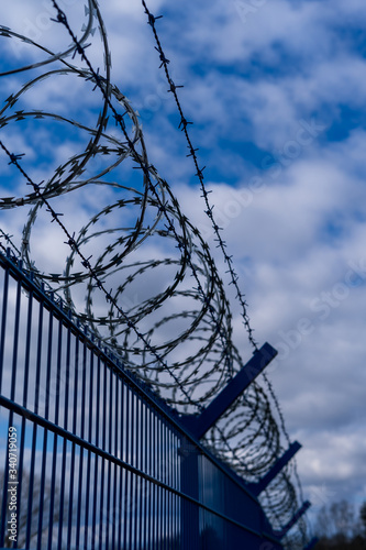 Prison barbed wire. Prison fence. Strict punishment for crimes