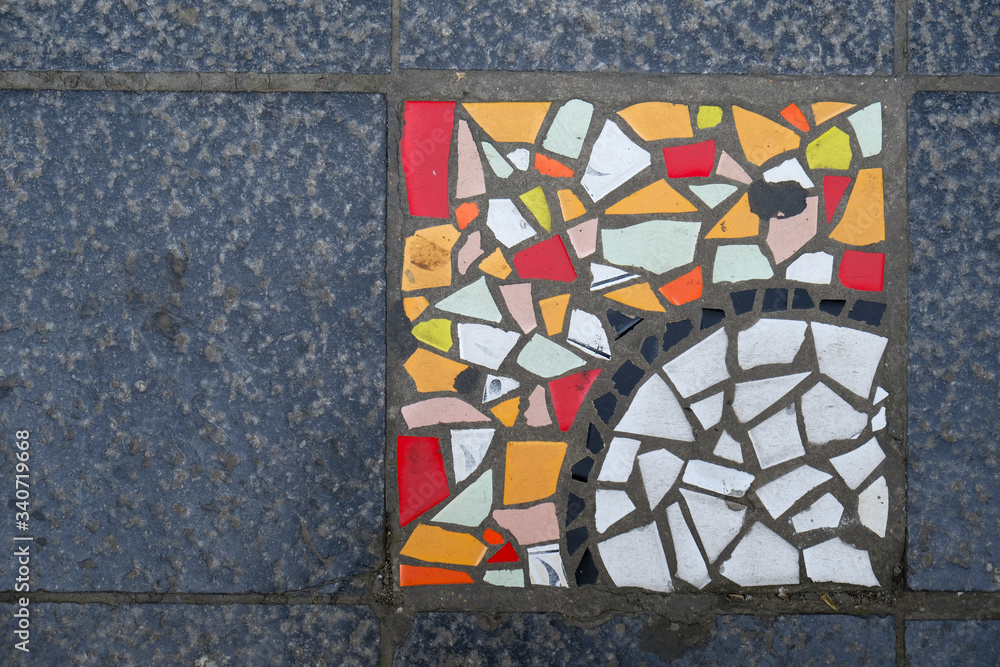Detail of a multicolored glass mosaic on the floor, mosaic background, texture. Detail of a multicolored glass mosaic on the floor, mosaic background, texture.
